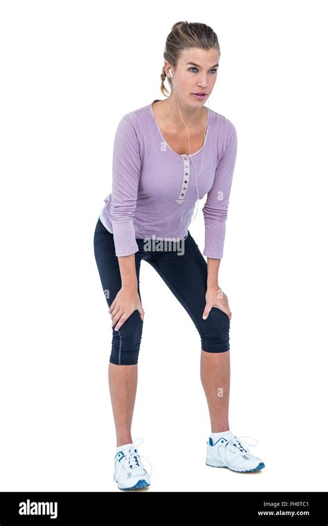 Young Woman Bending With Hand On Knee Stock Photo Alamy