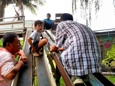 The recycled materials such as tires and buckets donated by the residents were. Aly's Blog: DIY Playground - Batu Pahat