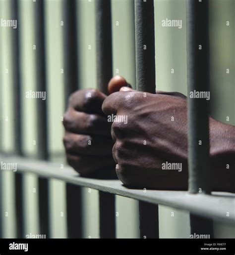 Hand Behind Prison Bars Hi Res Stock Photography And Images Alamy