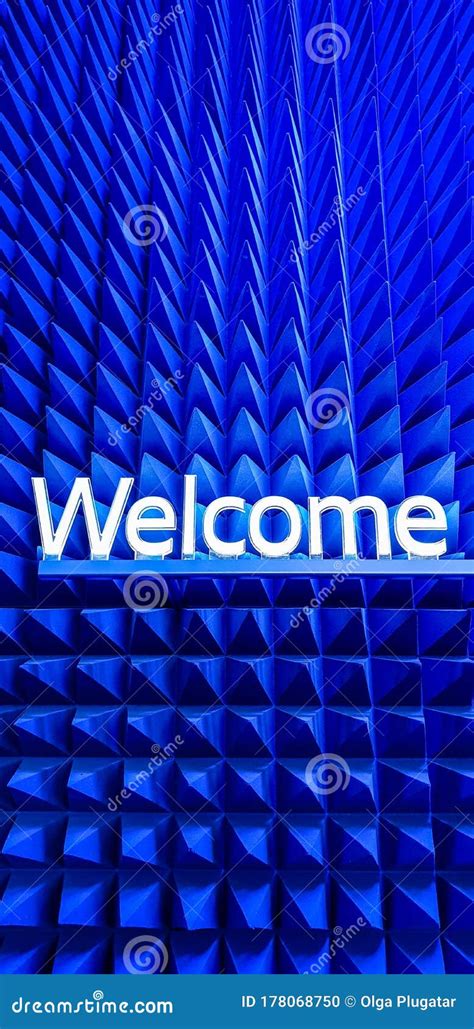 Welcome Text On A Blue Spike Background From Acoustic Foam Pyramid