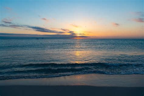 Beautiful Sunset With Pacific Water On The Summer Beach Stock Photo