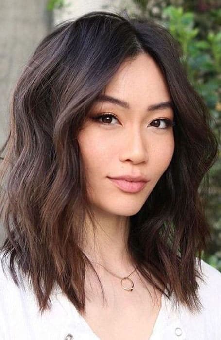 35 best middle part hairstyles for women in 2024