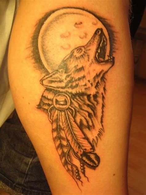 The 85 Best Wolf Tattoos For Men Improb Feather Tattoo Design Moon Tattoo Designs Temporary