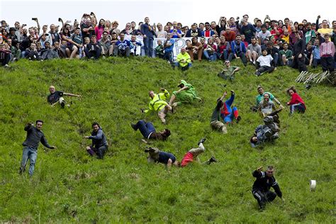 The Annual Cheese Rolling Race On Coopers Hill In Gloucestershire