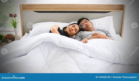 Young Loving Couple In The Bed And Romantic Couple In Love On Bedtime And Happiness Concept