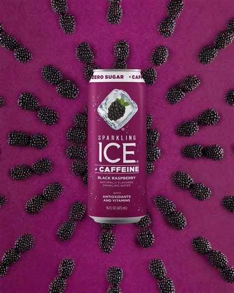A Can Of Sparkling Ice Caffeine Surrounded By Blackberries On A Purple