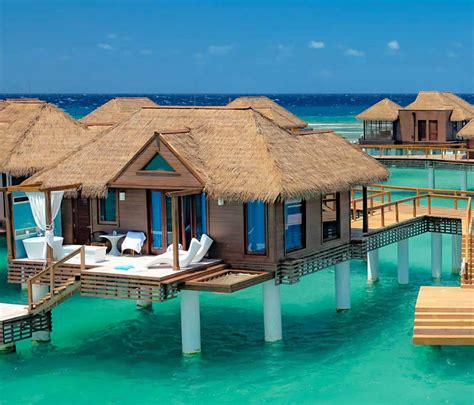 discover tropical romance in 3 overwater bungalow resorts on the caribbean sea