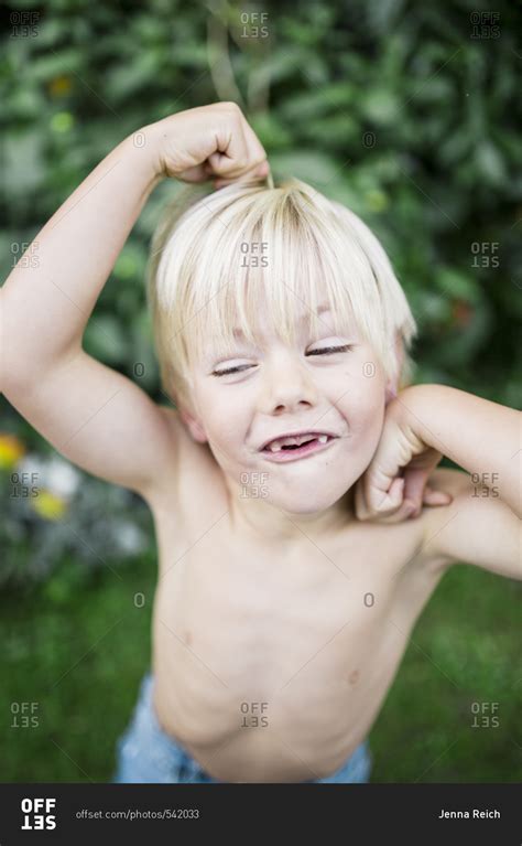 Blonde Boy Making Silly Faces Outdoors Stock Photo Offset