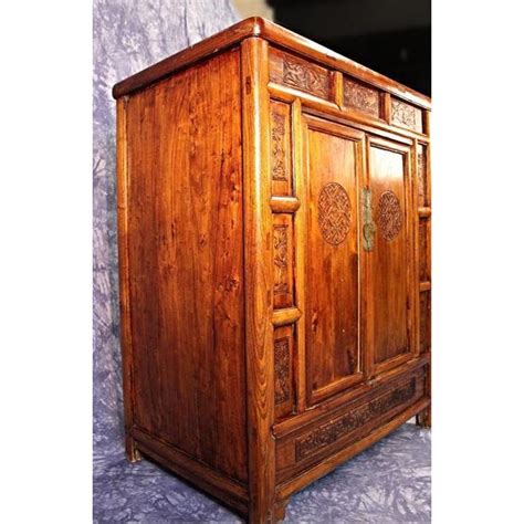 What are the shipping options for teak linen cabinets? Antique Chinese Carved Teak Cabinet | Chairish
