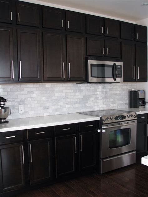 Take the kitchen above for example. Kitchen Backsplash Dark Cabinets dark birch kitchen ...