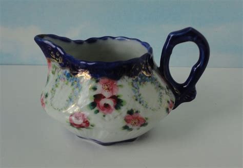 $9.99 vintage cat centrum ceramic sitting cat figurine blue white floral pattern 7. vintage Porcelain Creamer with blue rim and handle, floral ...