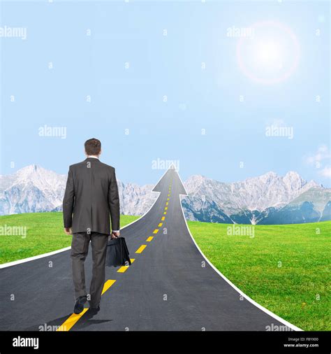 Man Walking On Highway Road Going Up As An Arrow Stock Photo Alamy