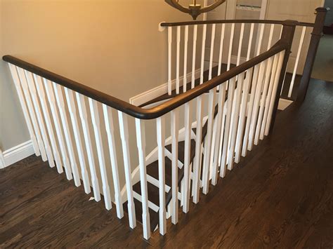Refinished Staircase Railing And Posts Along With Existing Hardwood