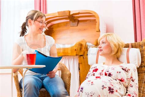 Midwife Seeing Pregnant Mother In Practice Stock Image Colourbox
