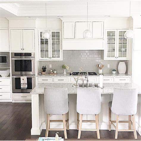 Maybe you would like to learn more about one of these? @carolineondesign White kitchen with grey subway tile ...