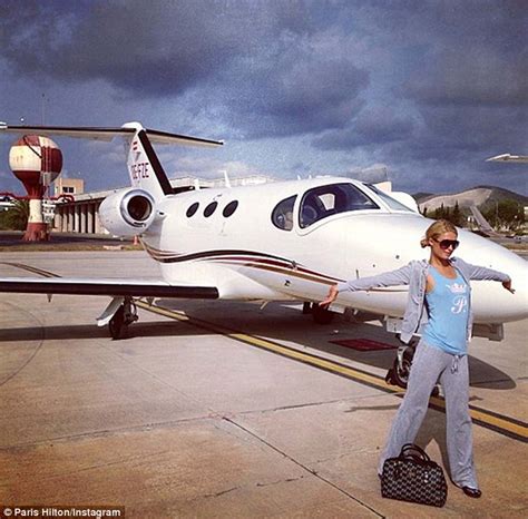 Paris Hilton Flaunts Her Decadent Lifestyle As She Poses In Front Of