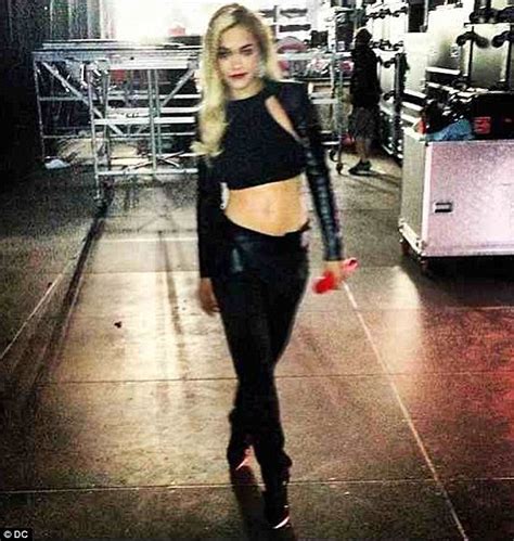Rita Ora Proudly Shows Off Her Toned Tummy Onstage In A Leather Crop