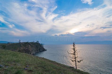 A Sacred Cape Burkhan And Lonely Tree At Sunset In Summertime Olkhon