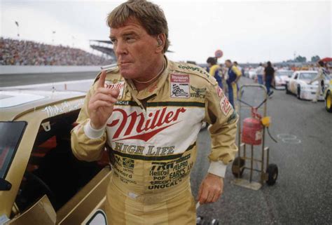 Dick Trickle Smokes A Cigarette Before The 1989 Southern 500 Race At