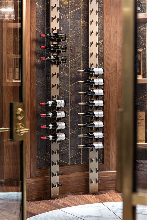Architectural features such as tray ceilings add interest and value to a home's interior. Elegant wine room with Liquid Systems wine racks. The ...