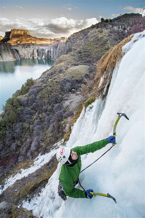 Ice Climber Acending A Frozen Waterfall Near Shoshone Falls Photograph