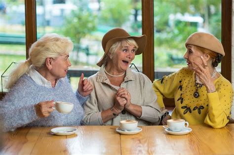 Premium Photo Three Senior Ladies Drinking Coffee
