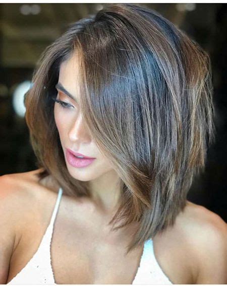 This short bob hair with red highlights bangs and layers is a perfect style for women of all ages. Stunning Long Bob Haircut with Layers
