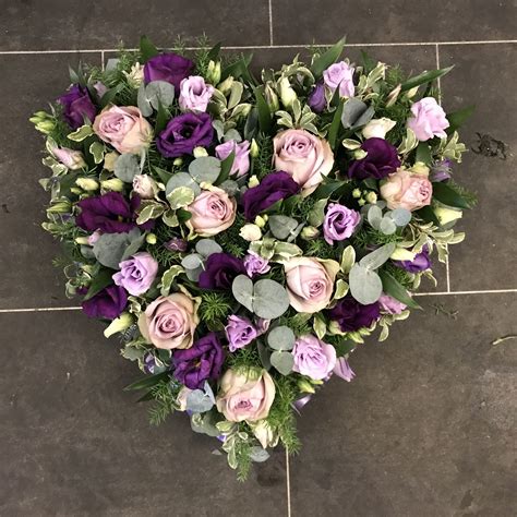 Pretty Purple And Lilac Heart Shaped Funeral Flowers Tribute Wreath