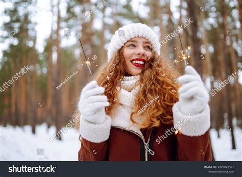 Cheerful Young Woman Holding Sparkler Hand Stock Photo 2225078581