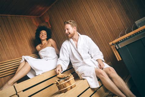 Young Happy Couple Relaxing Inside A Sauna At Spa Resort Hotel Luxury