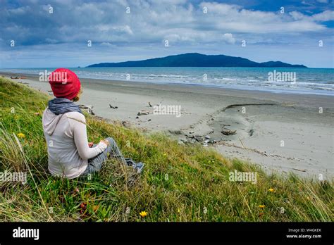 Woman Resting At Foxton Beach Kapiti Coast North Island New Zealand