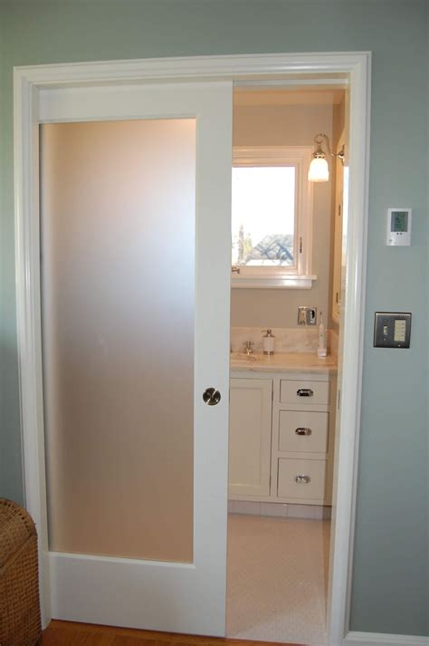 An Open Door Leading To A Bathroom In A House
