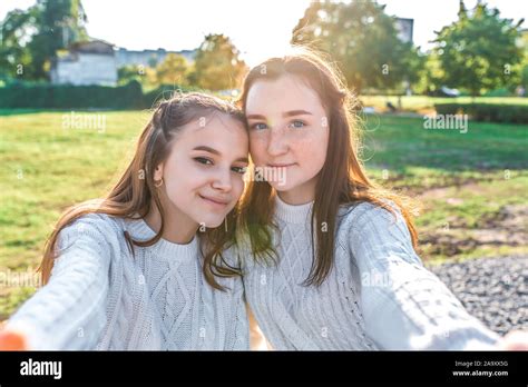 Two Girls Schoolgirls Girlfriends 12 15 Years Old Take Selfie On Phone In Summer In City After