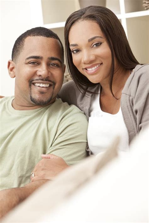 happy african american couple sitting at home stock image image of african female 22971573