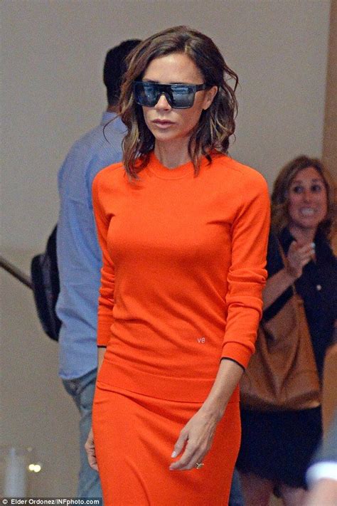 Victoria Beckham Leaves Hotel In Personalised Orange Dress After Nyfw Victoria Beckham