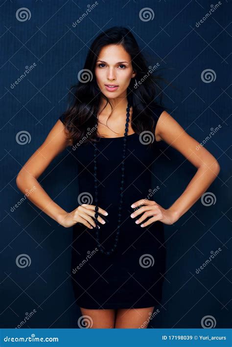 Royalty Free Stock Images Sultry Brunette Posing With Hands On Hips