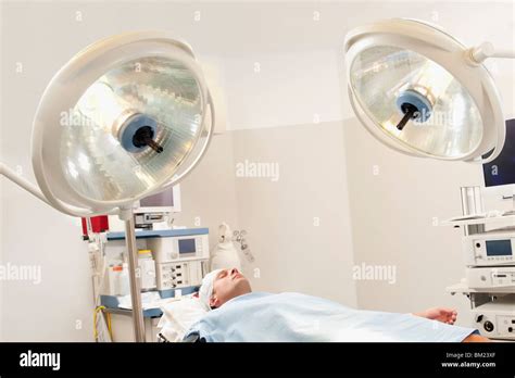 Patient Lying Down On An Examination Table Hi Res Stock Photography And