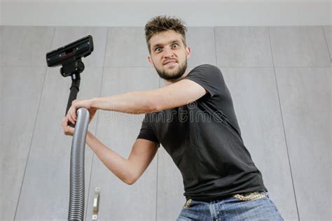 A Man With A Vacuum Cleaner Is Tired Of Cleaning The House Stock Image Image Of Hoover Dust