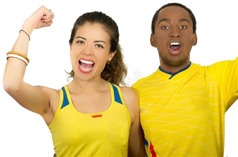 Charming Interracial Couple Wearing Yellow Football Shirts Cheering Joyfully To Camera White