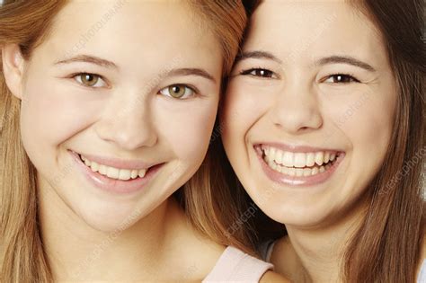 close up of teenage girls smiling faces stock image f007 0452 science photo library