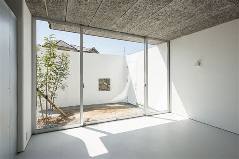 Ym Design Office Clads Half Of Stylobate House With
