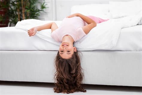 Free Photo Low Angle Girl On Bed Edge With Head Hanging