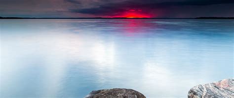 Download Wallpaper 2560x1080 Lake Sunset Landscape Water Stones