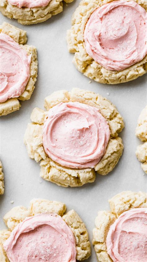 these soft frosted sugar cookies are so delicious and delicate they have a cream cheese