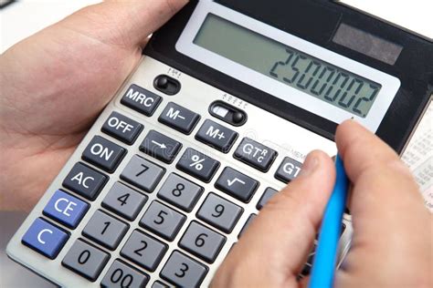 Businessman With Calculator In The Office Stock Photo Image Of Paper