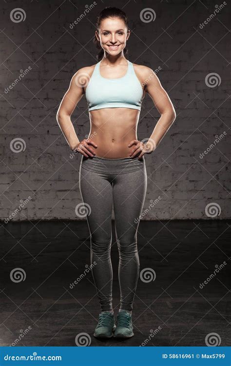Sporty Woman With A Beautiful Smile Fitness Female With Muscular Body