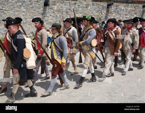 American Revolutionary War Reenactors Marching Off To A Battle Stock