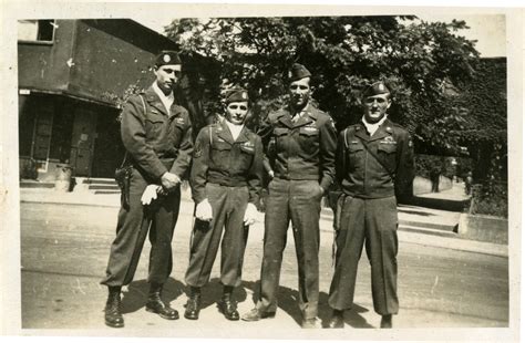 Four 82nd Airborne Division Paratroopers Stand Together Outside The