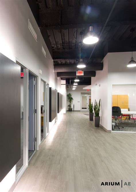 Corridor In An Office Space With Black Laminate Accent Wall With Light
