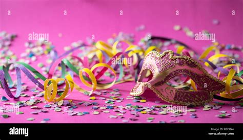 Carnival Party Pink Gold Mask Streamers And Confetti On Bright Pink